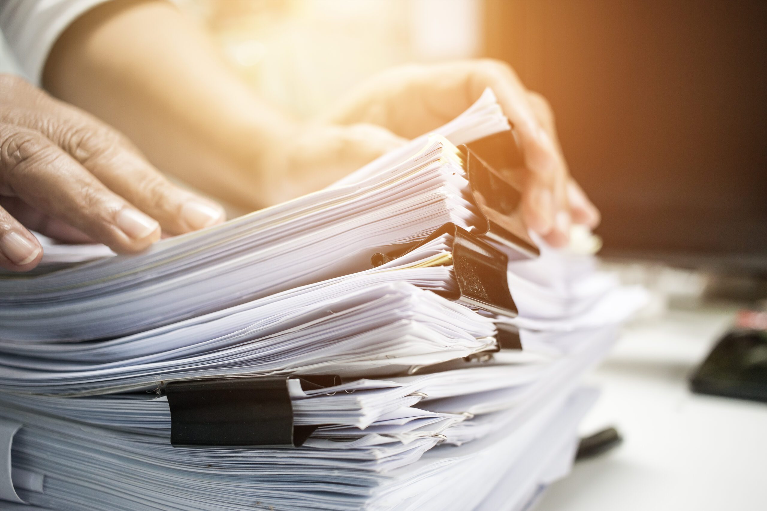 Businessman Hands Working In Stacks Of Paper